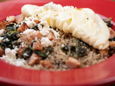 A quinoa protein bowl with eggs and avocado.